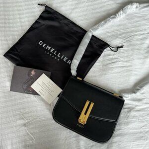 Demellier black smooth bag